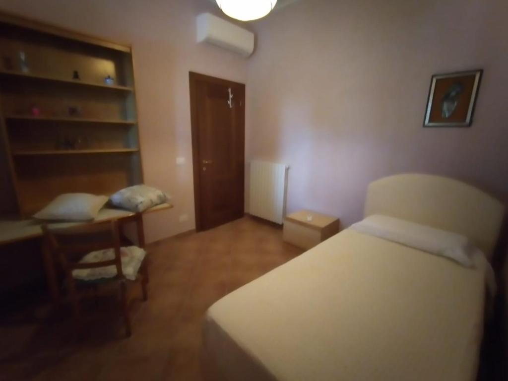 Postel nebo postele na pokoji v ubytování B&B L'Oliveto