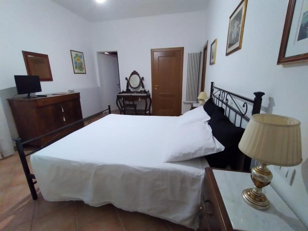 Postel nebo postele na pokoji v ubytování B&B L'Oliveto