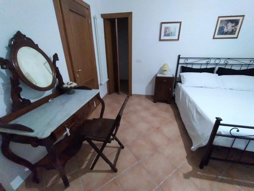 Postel nebo postele na pokoji v ubytování B&B L'Oliveto