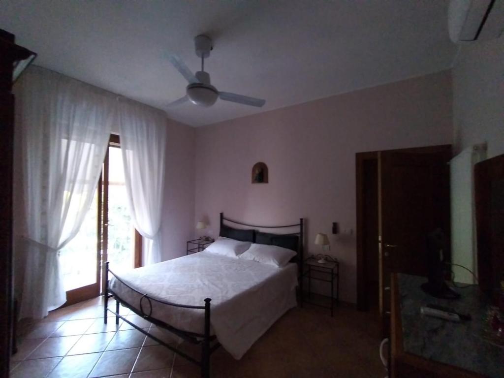 Postel nebo postele na pokoji v ubytování B&B L'Oliveto