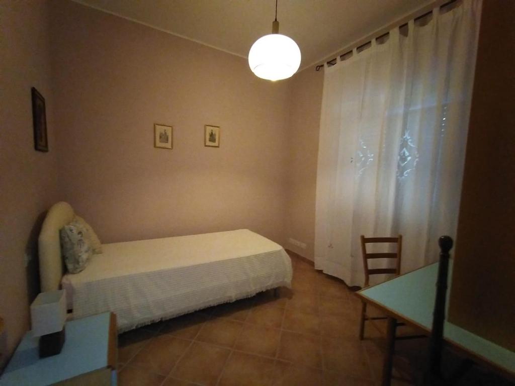 Postel nebo postele na pokoji v ubytování B&B L'Oliveto