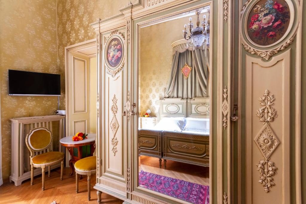a bedroom with a bed in a room at Casa della Contessa B&B in Turin