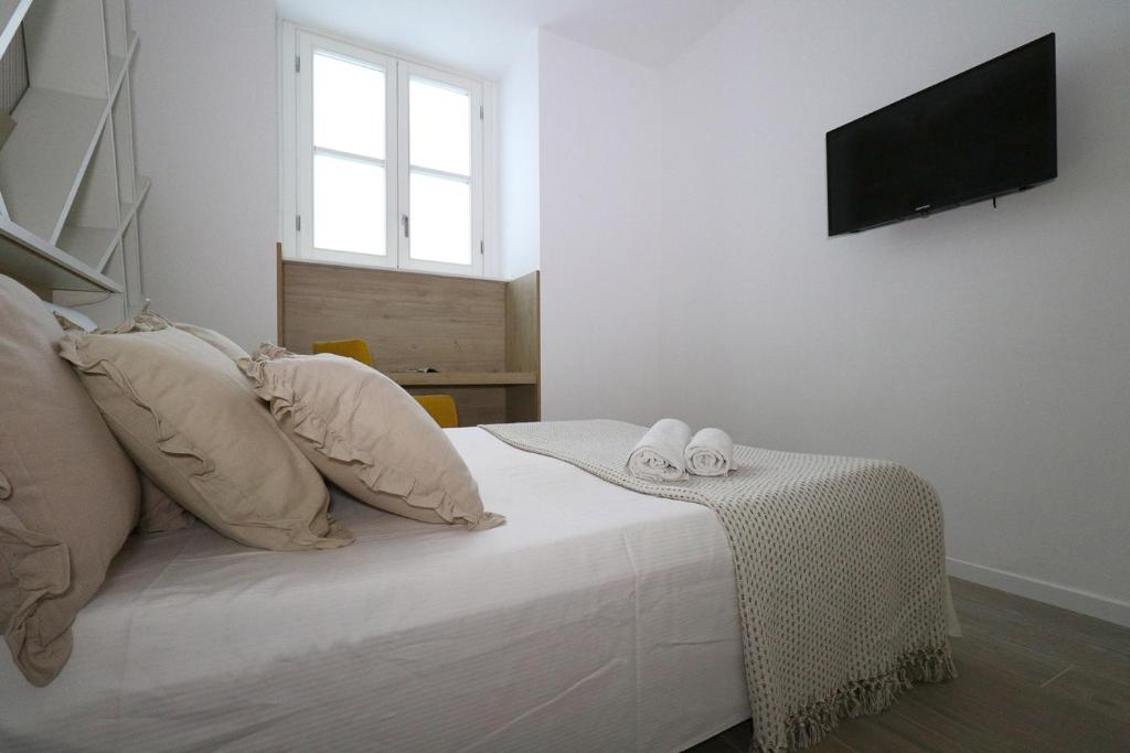 Postel nebo postele na pokoji v ubytování Affittacamere I Due Leoni
