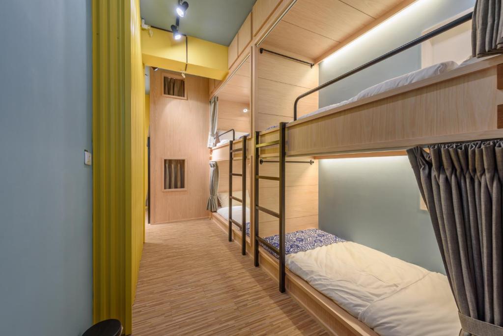 Postel nebo postele na pokoji v ubytování 山多香青年民宿 Santhosham Hostel