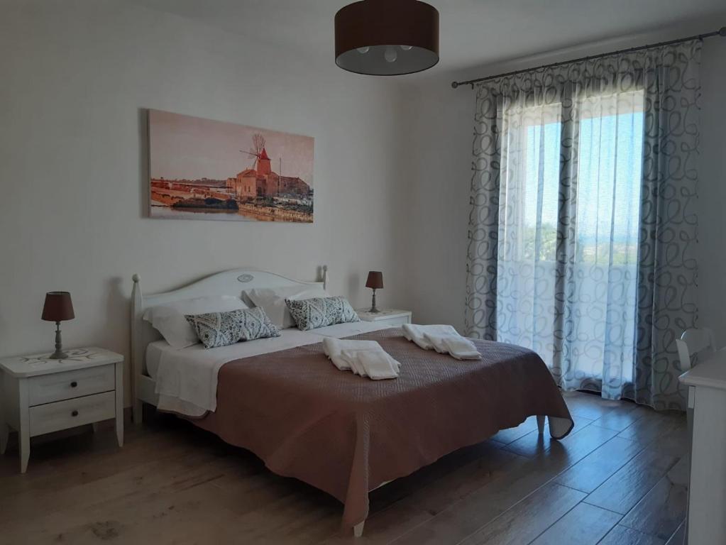 Postel nebo postele na pokoji v ubytování Stella Fenicia