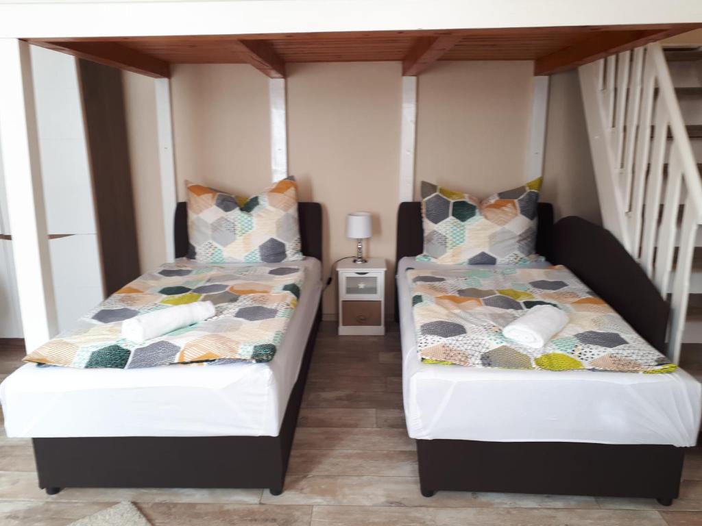 Postel nebo postele na pokoji v ubytování Edina Apartman