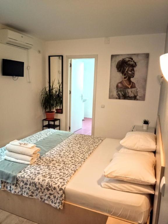 Postel nebo postele na pokoji v ubytování Central Guesthouse