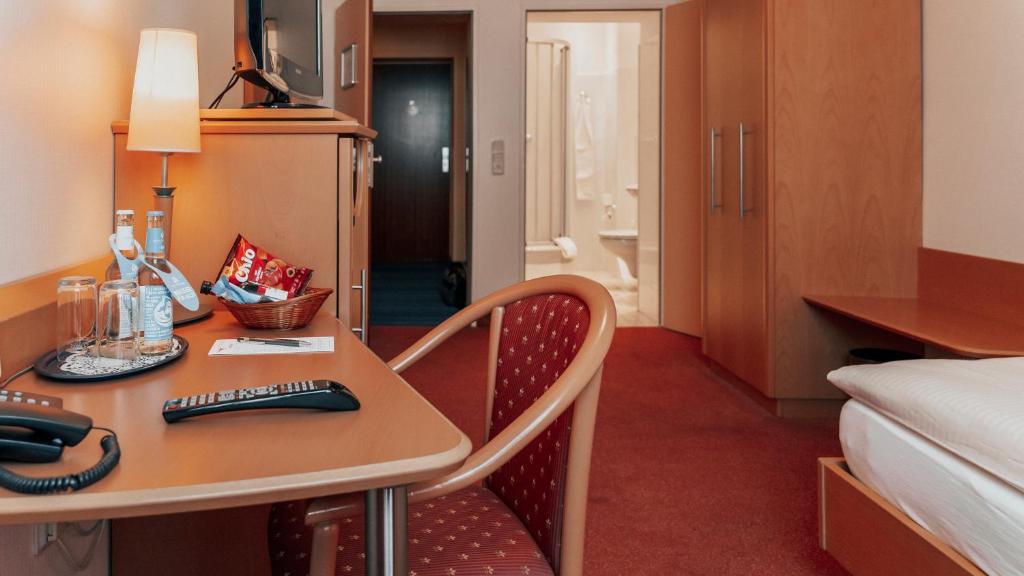 Postel nebo postele na pokoji v ubytování Avantgarde Hotel