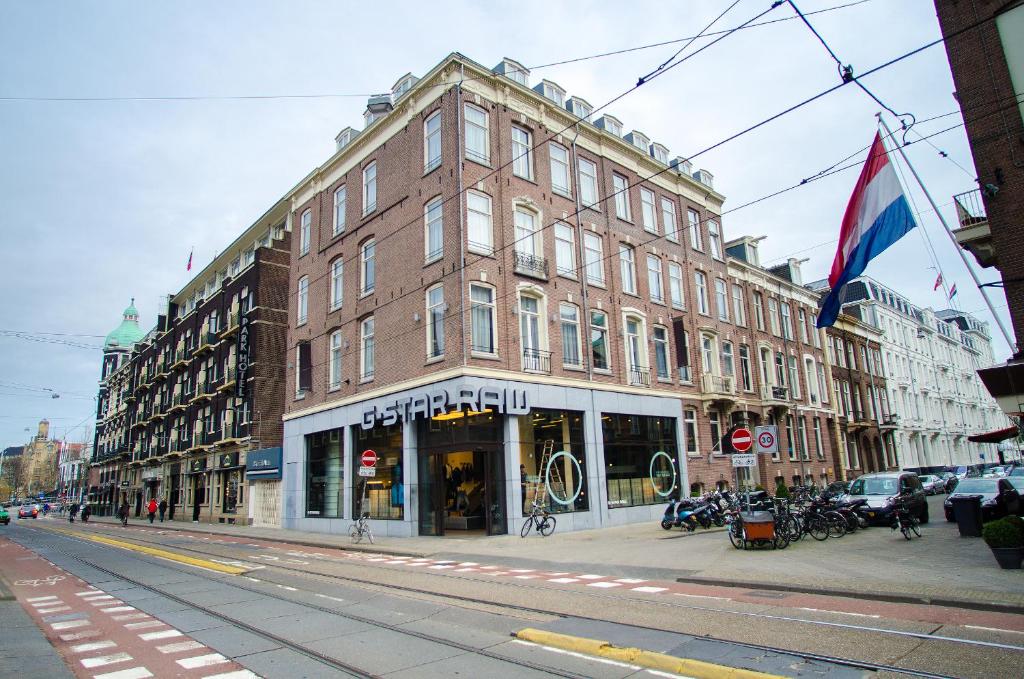 a large brick building on a city street at Hotel Cornelisz in Amsterdam