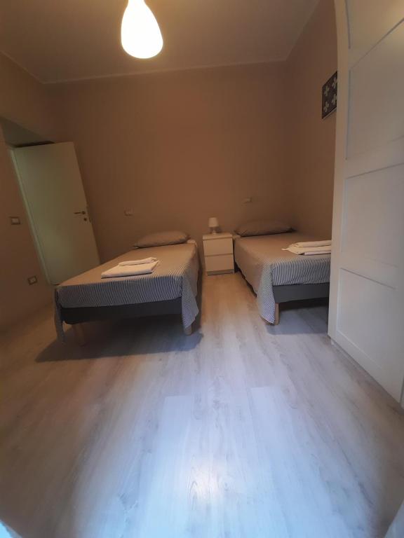 Łóżko lub łóżka w pokoju w obiekcie Appartamento Porta Maggiore