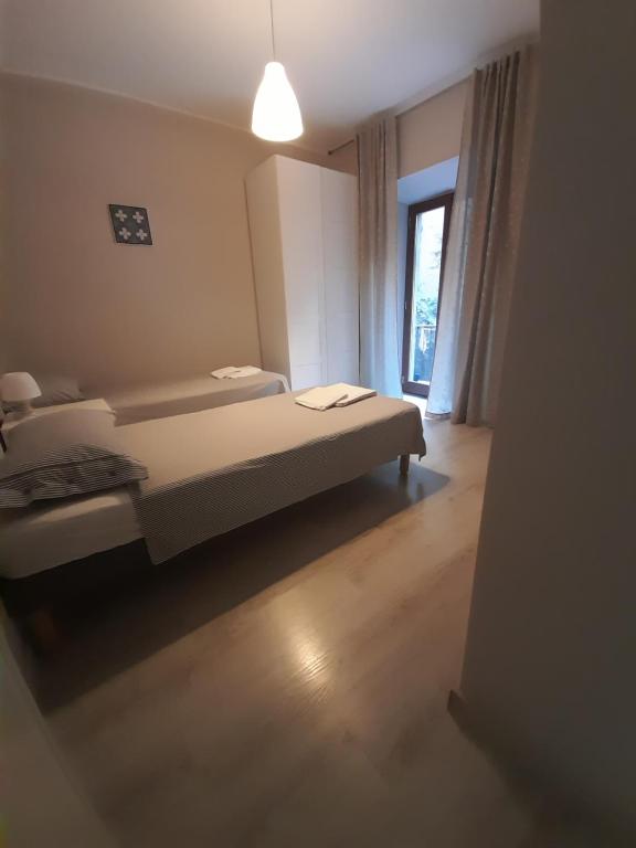 Łóżko lub łóżka w pokoju w obiekcie Appartamento Porta Maggiore