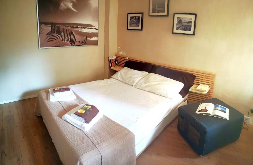 Łóżko lub łóżka w pokoju w obiekcie Appartamento Signoria