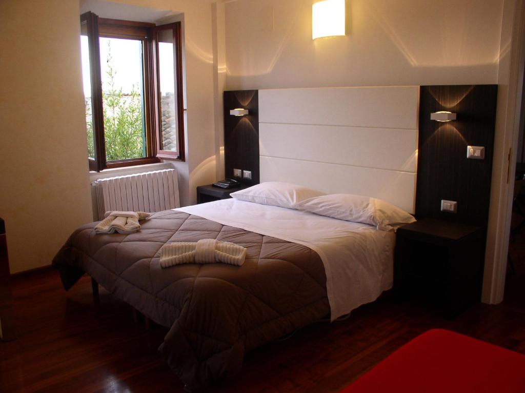 Postel nebo postele na pokoji v ubytování Primavera Mini Hotel