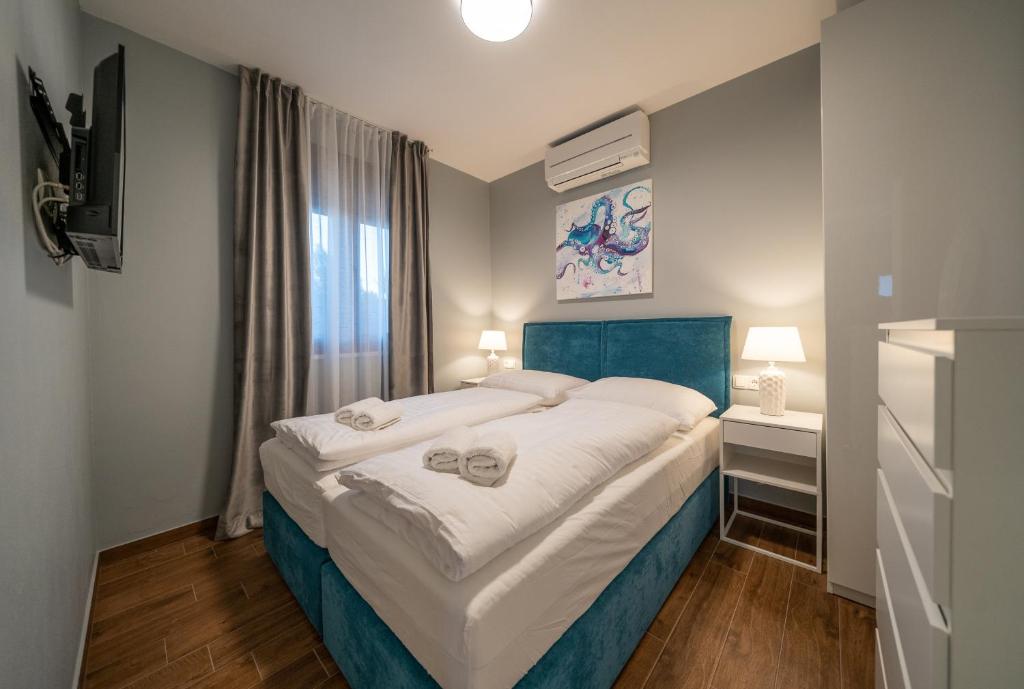 Posteľ alebo postele v izbe v ubytovaní Villa Olivetum