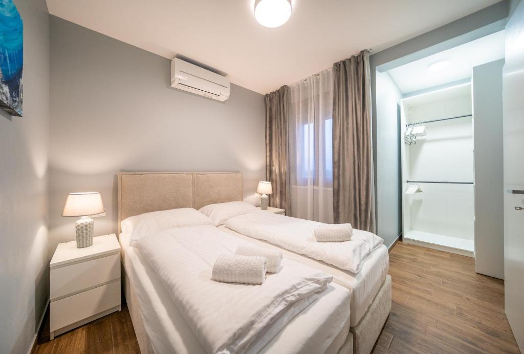 Posteľ alebo postele v izbe v ubytovaní Villa Olivetum