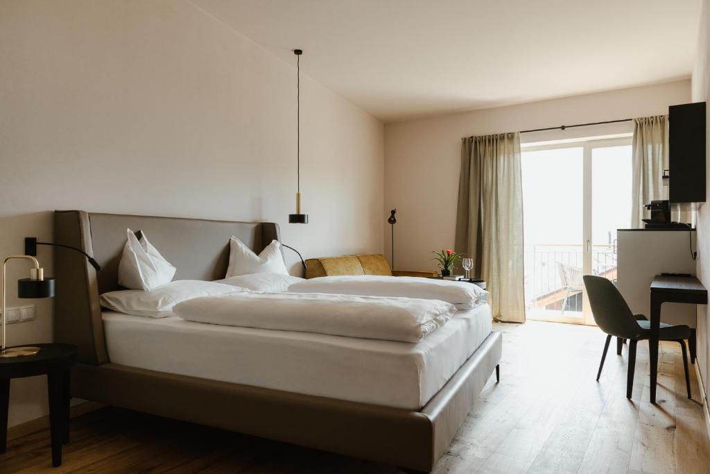 Posteľ alebo postele v izbe v ubytovaní Ansitz am Eck by Hotel Pernhof