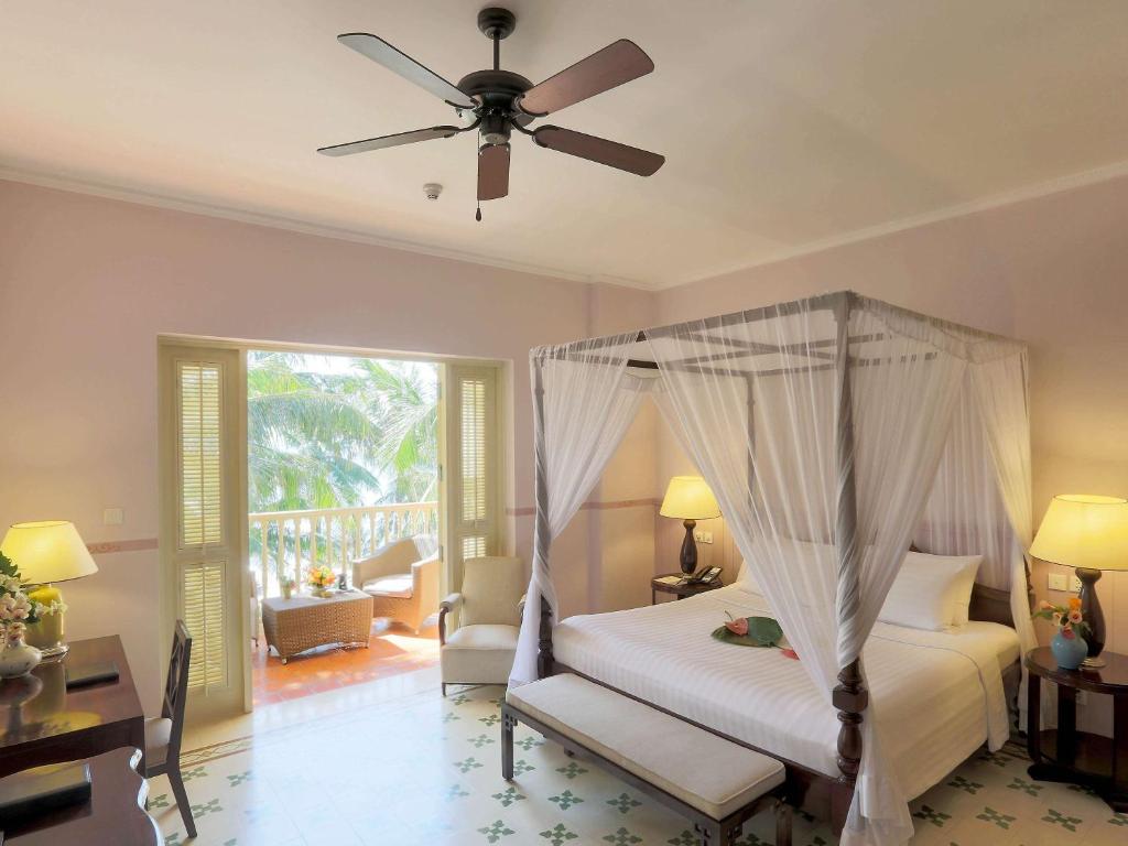 Postel nebo postele na pokoji v ubytování La Veranda Resort Phu Quoc - MGallery
