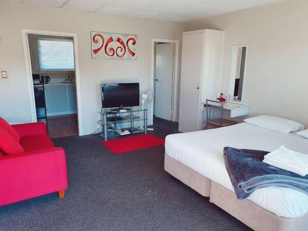 TV a/nebo společenská místnost v ubytování Classique Lodge Motel