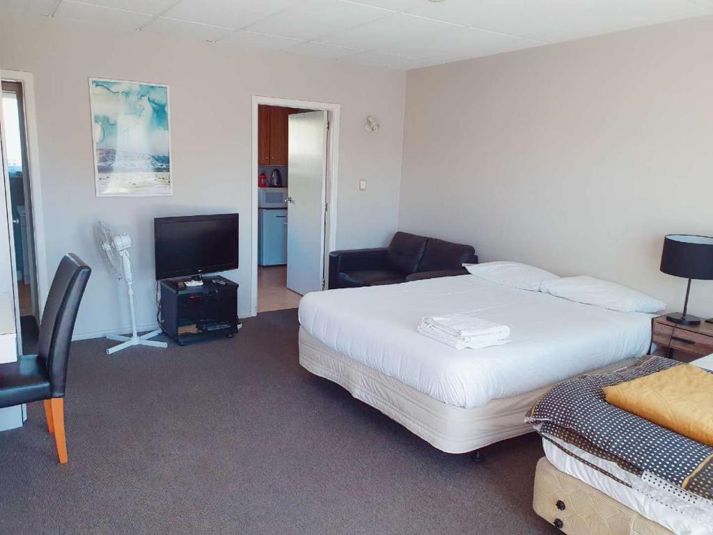 Postel nebo postele na pokoji v ubytování Classique Lodge Motel