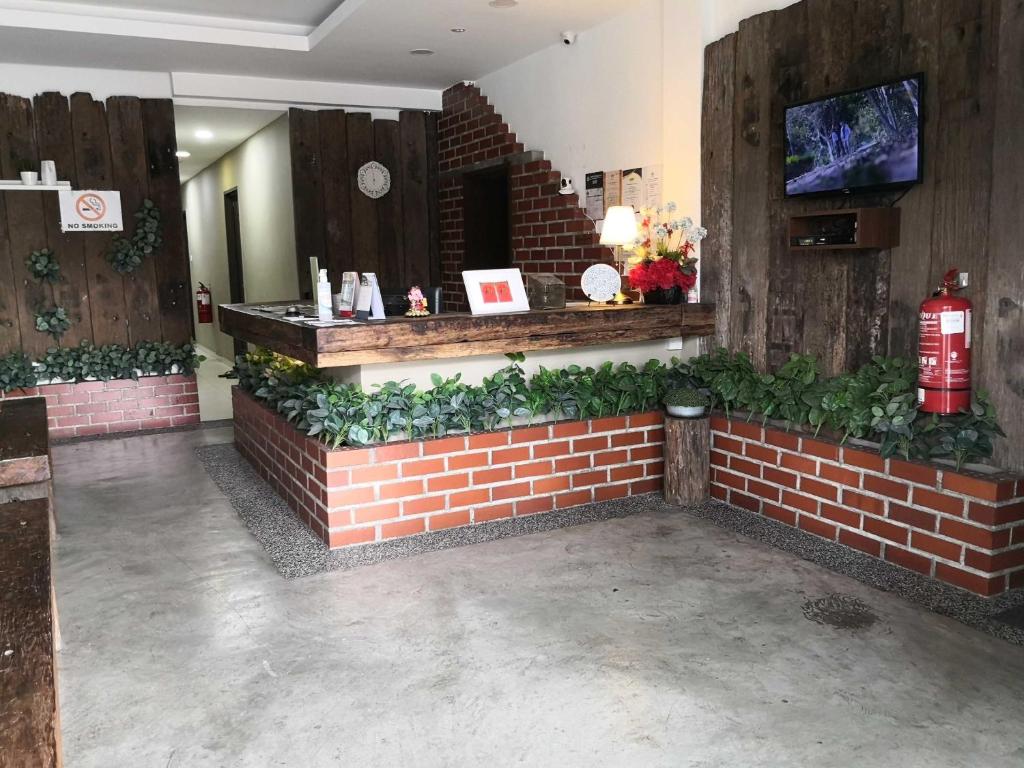 TV a/nebo společenská místnost v ubytování Tropika Garden Hotel Kulai