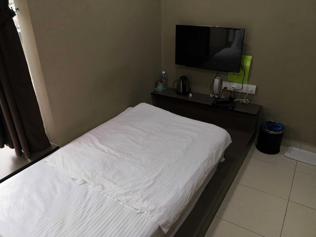 TV a/nebo společenská místnost v ubytování Tropika Garden Hotel Kulai