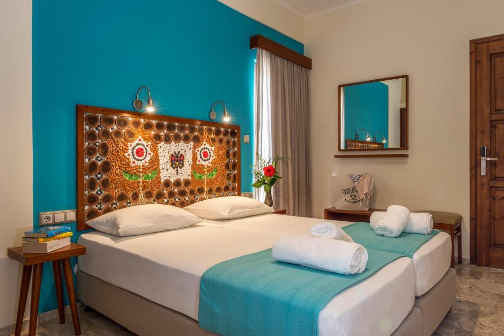 Postel nebo postele na pokoji v ubytování Aris Boutique Hotel