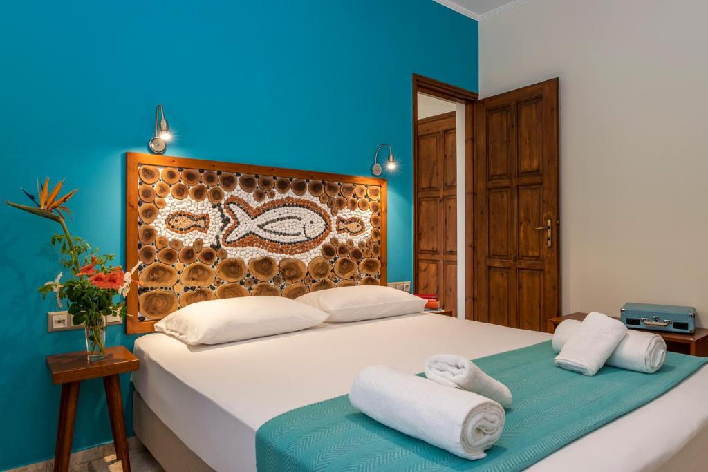 Postel nebo postele na pokoji v ubytování Aris Boutique Hotel