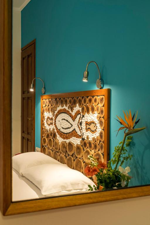 Postel nebo postele na pokoji v ubytování Aris Boutique Hotel
