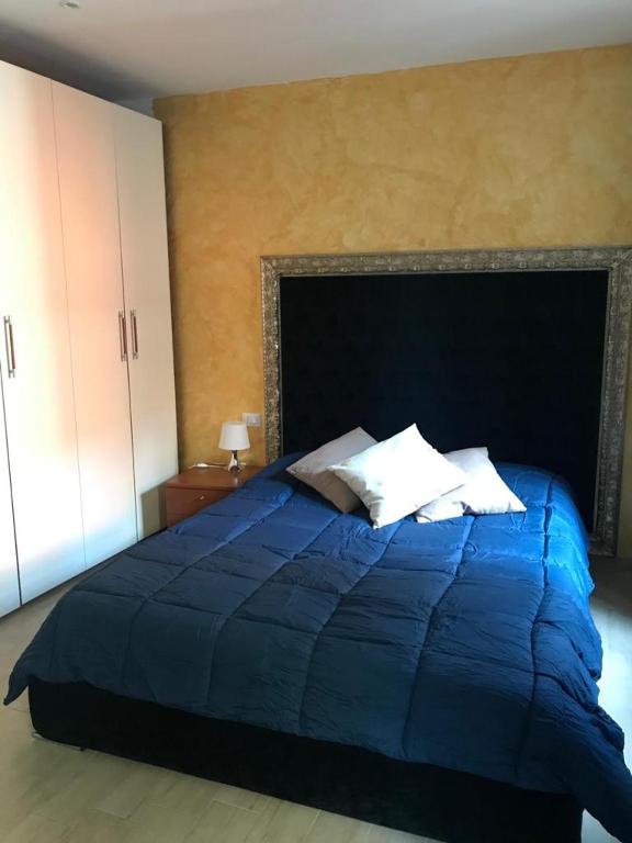 Posteľ alebo postele v izbe v ubytovaní Blu Suite