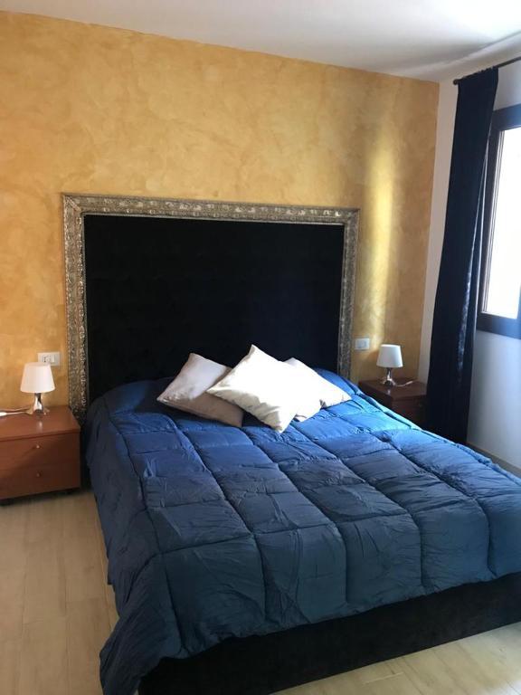 Posteľ alebo postele v izbe v ubytovaní Blu Suite