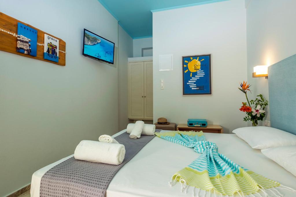 Postel nebo postele na pokoji v ubytování Aris Boutique Hotel
