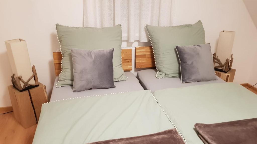 A bed or beds in a room at Gästehaus Sabine