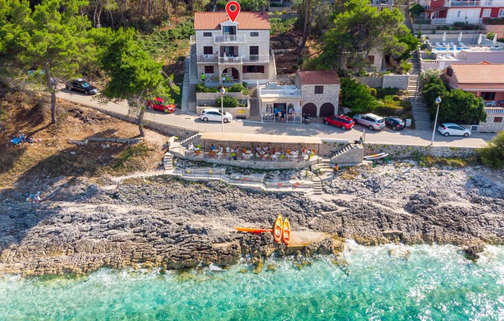 an aerial view of a beach with a building and the water at Beachfront Villa Tempera with Seaview in Blato