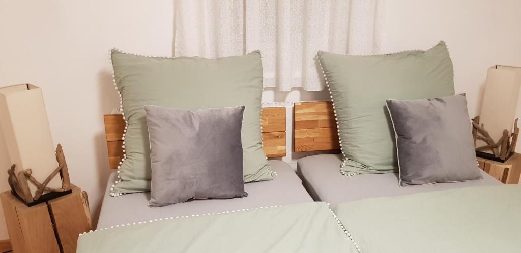 A bed or beds in a room at Gästehaus Sabine