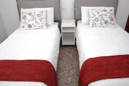 A bed or beds in a room at Al Portico d'Ottavia