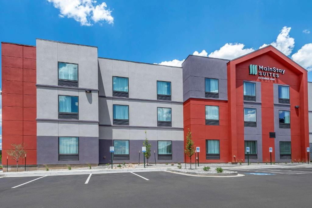 a building with a million smiles sign in front of a parking lot at MainStay Suites Durango in Durango