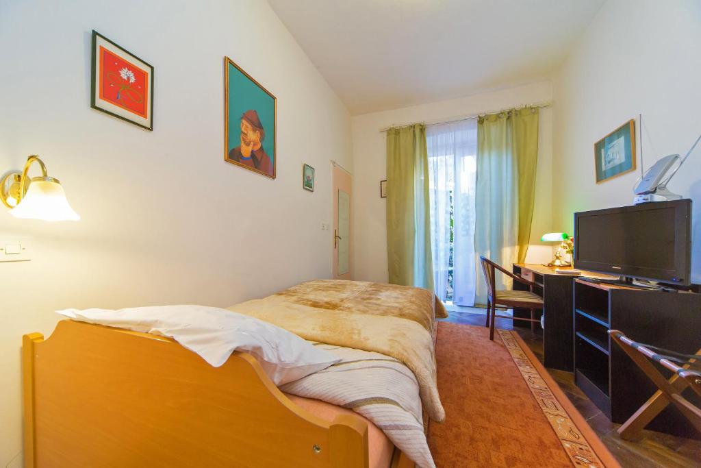 Телевизор и/или развлекательный центр в B&B Sesame Inn