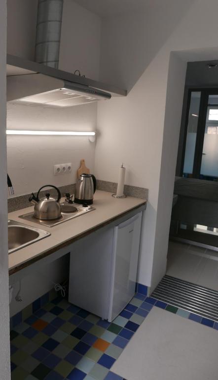 Kuchyňa alebo kuchynka v ubytovaní ROOMS BYTOM