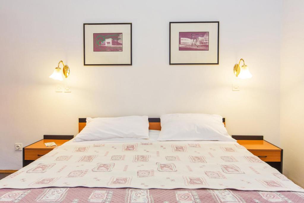 Кровать или кровати в номере B&B Sesame Inn