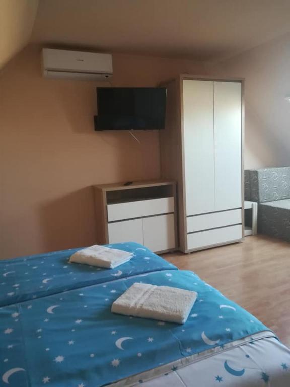 Posteľ alebo postele v izbe v ubytovaní Karika Vendégház