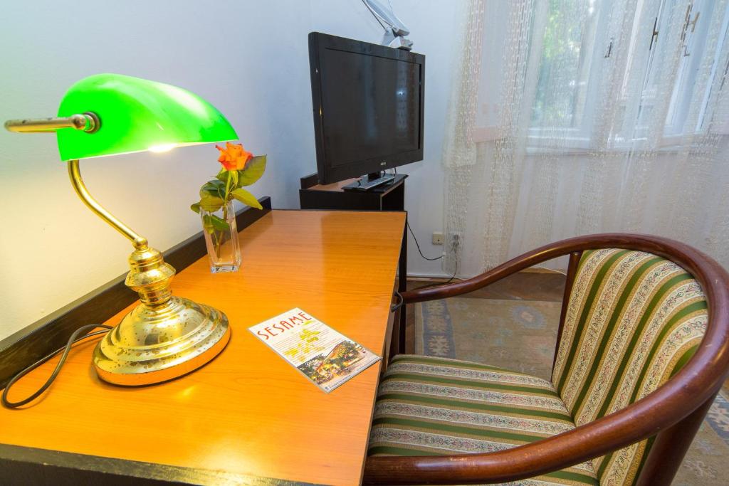 Телевизор и/или развлекательный центр в B&B Sesame Inn