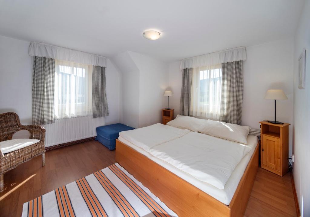Postel nebo postele na pokoji v ubytování MINERVA