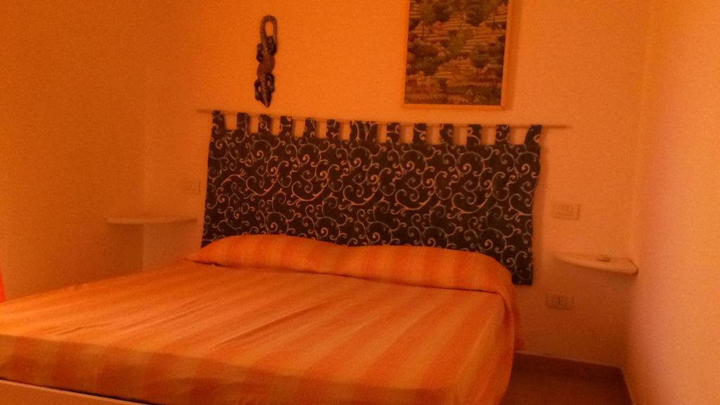 Katil atau katil-katil dalam bilik di AirPortMaterGialloALLIncludedFREEShuttleFROMairportTillNightPoolAirCondWifiParking