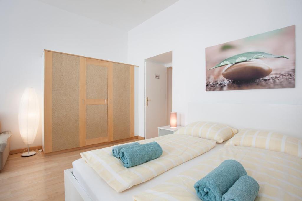 Łóżko lub łóżka w pokoju w obiekcie GAL Apartments Vienna