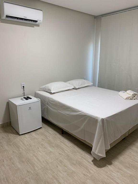 Postel nebo postele na pokoji v ubytování Suites Paraíso de Minas