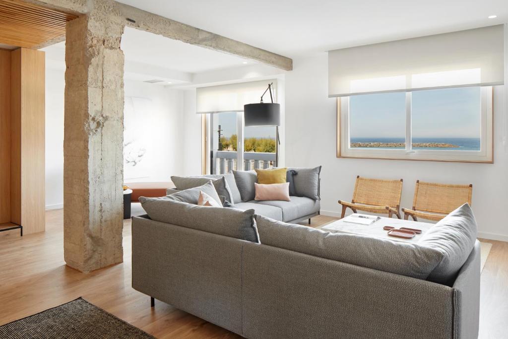 a living room with a couch and a table at Jai Alai 54 by FeelFree Rentals in Donostia-San Sebastián