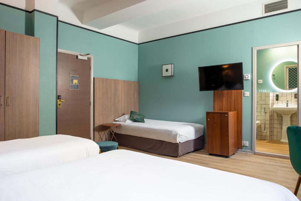 Postel nebo postele na pokoji v ubytování Hôtel Le Bristol