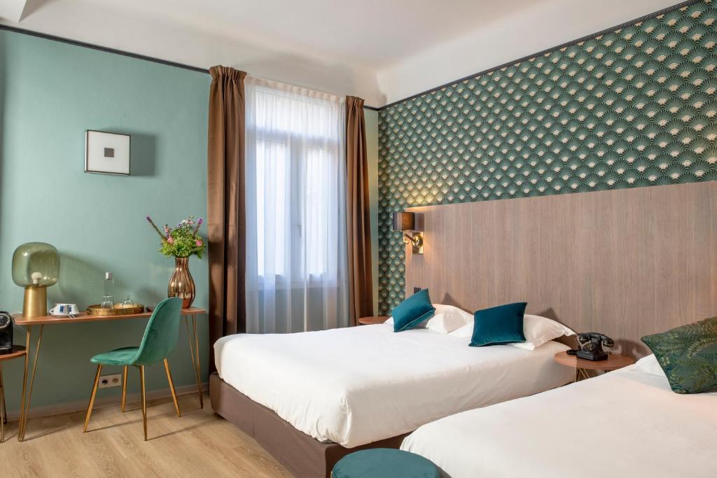Postel nebo postele na pokoji v ubytování Hôtel Le Bristol