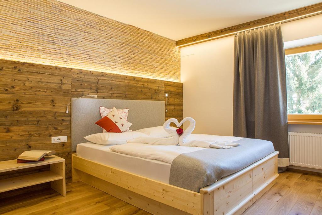 Voodi või voodid majutusasutuse Hotel Rosengarten toas
