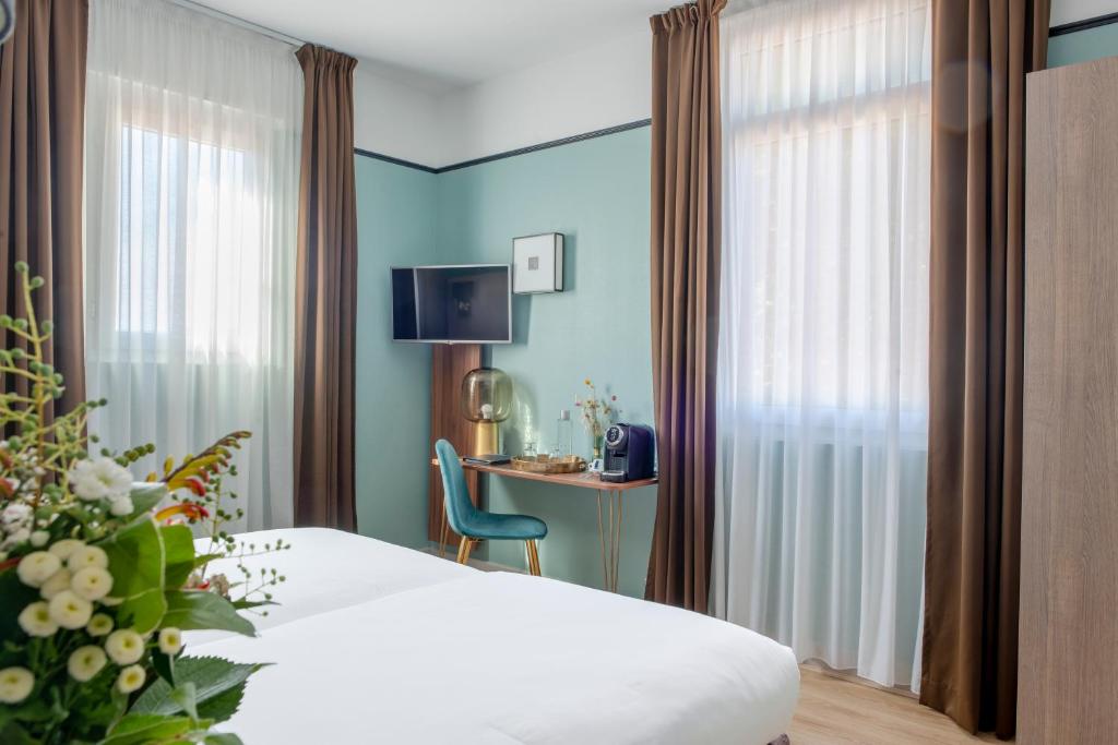 Postel nebo postele na pokoji v ubytování Hôtel Le Bristol